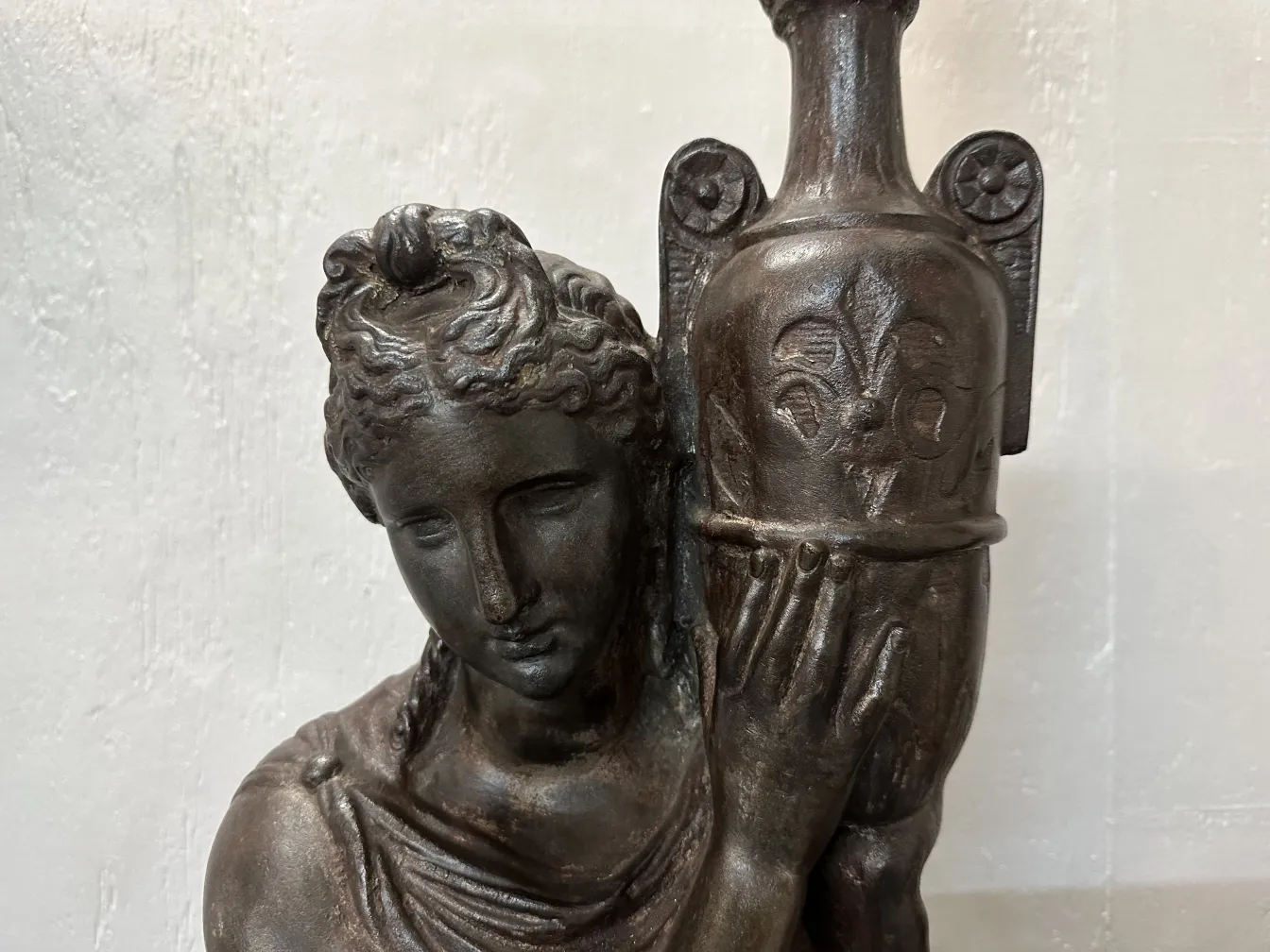 2 antique floor lamps with sculpted figure, neutral background