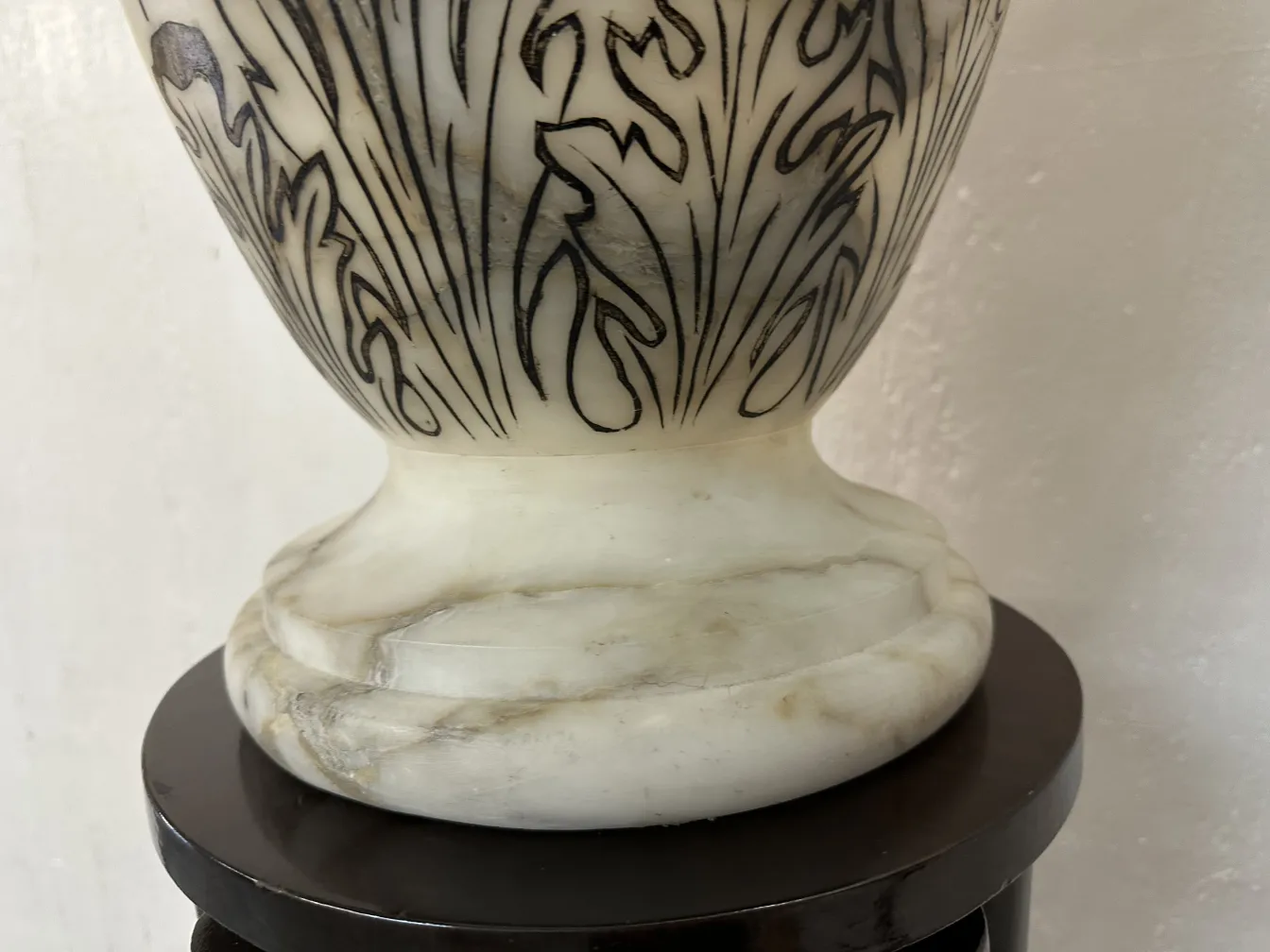 2 antique floor lamps with decorative base and floral design in a classic setting.