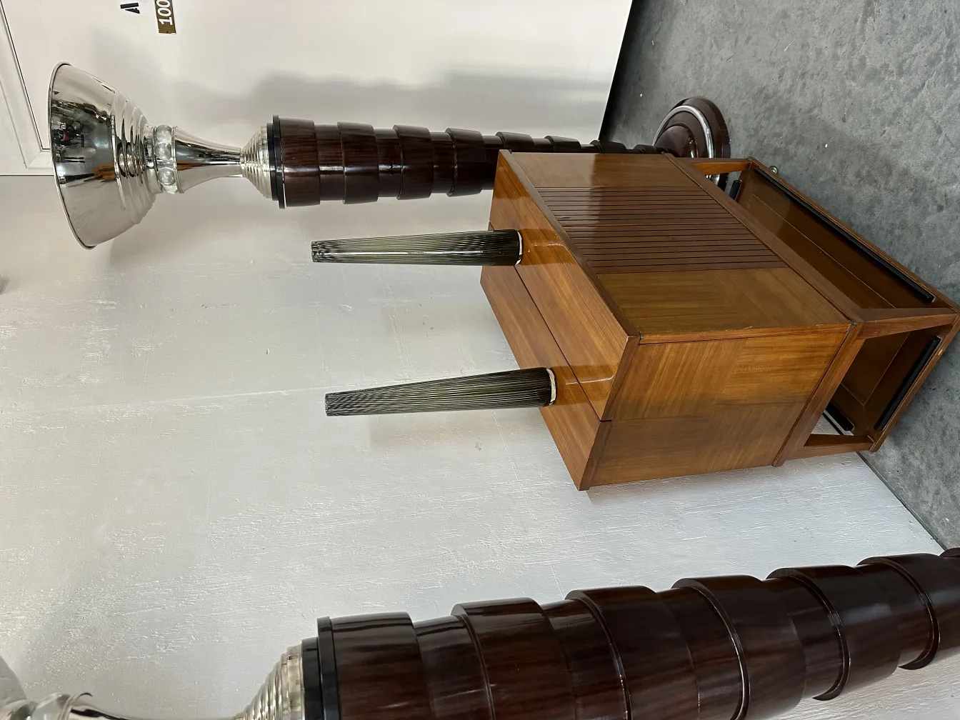 two antique floor lamps with detailed design in a modern setting