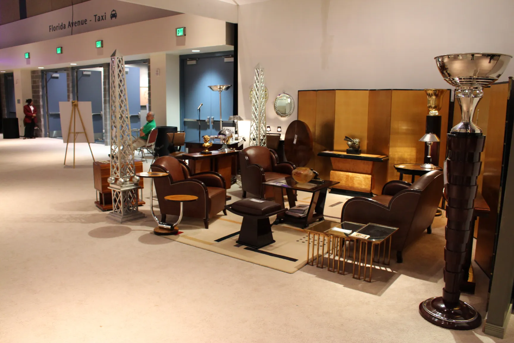 Two antique floor lamps in a vintage setting with furniture