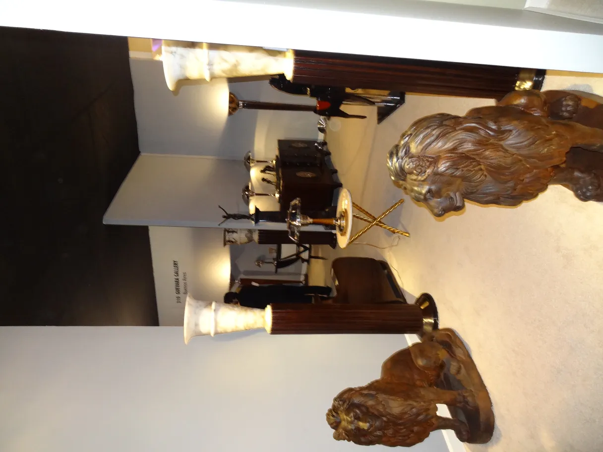 Two antique floor lamps in a decorative setting