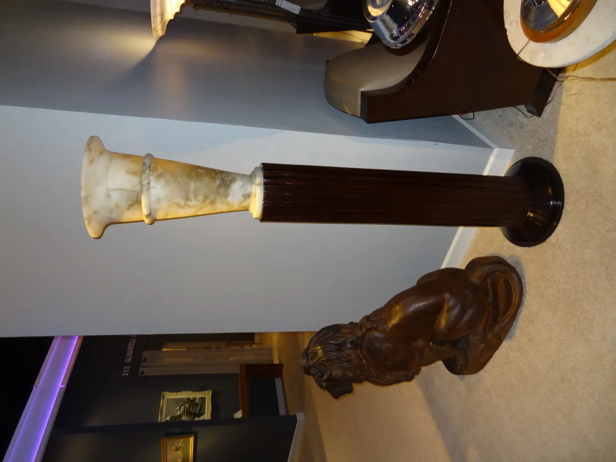 Antique floor lamps with decorative base and soft light in an elegant setting