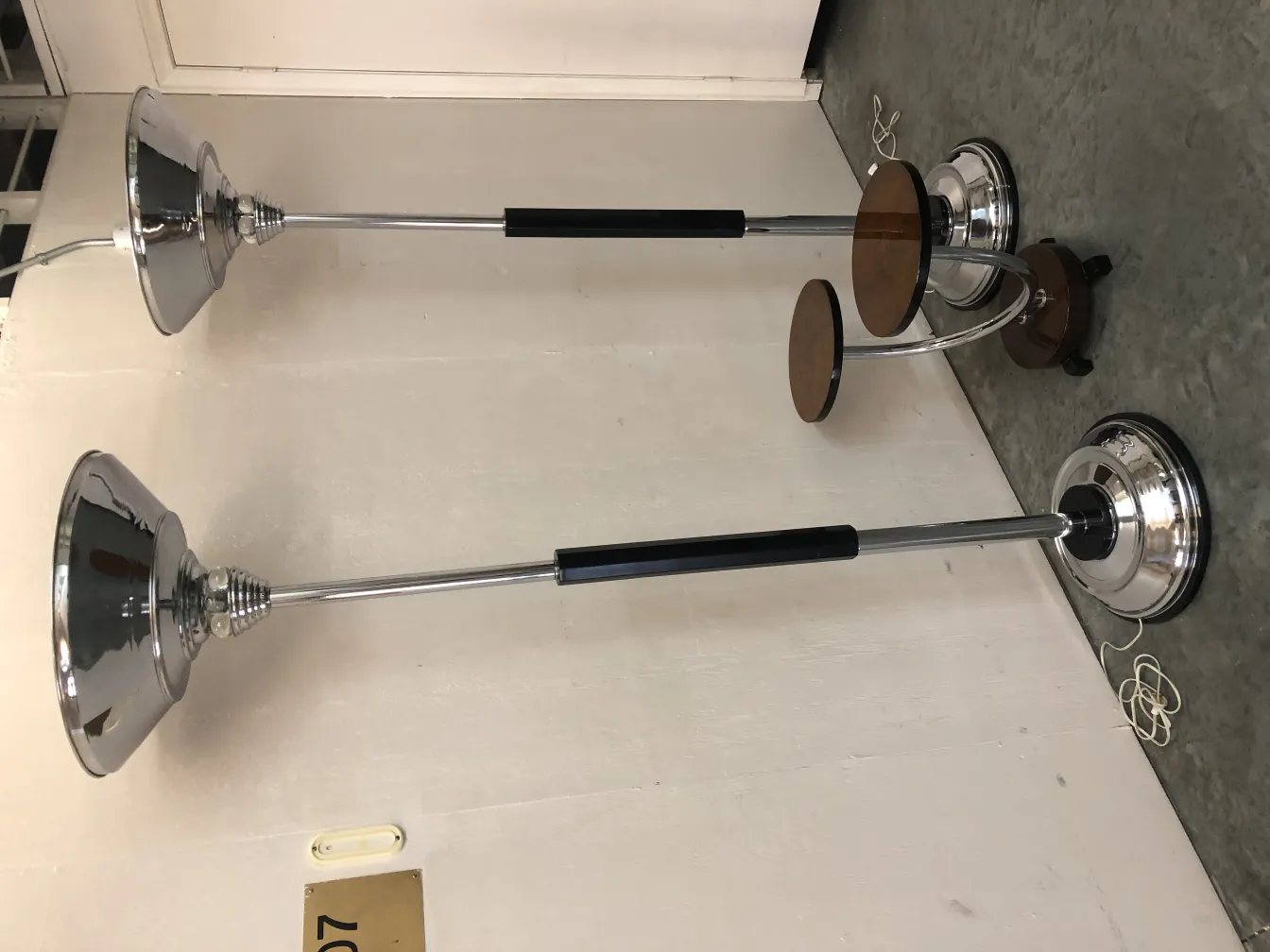 two antique floor lamps in a contemporary setting