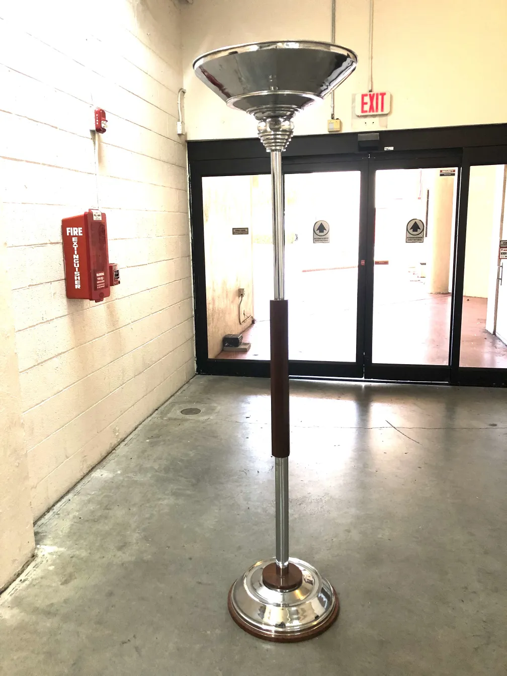two antique floor lamps in a well-lit hallway