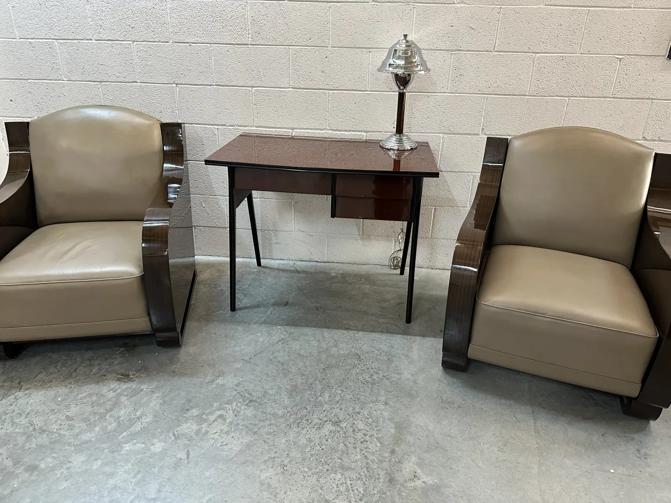 Two vintage armchairs with elegant curved arms in a cozy setting.