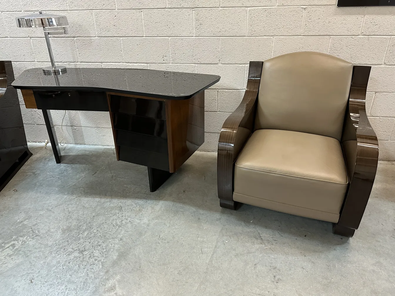 Two antique armchairs in a modern setting, one light-colored