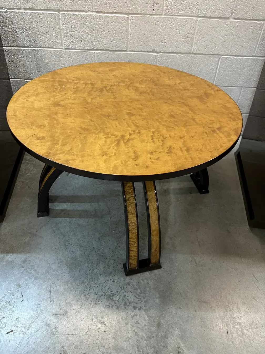 antique round coffee table on grey background