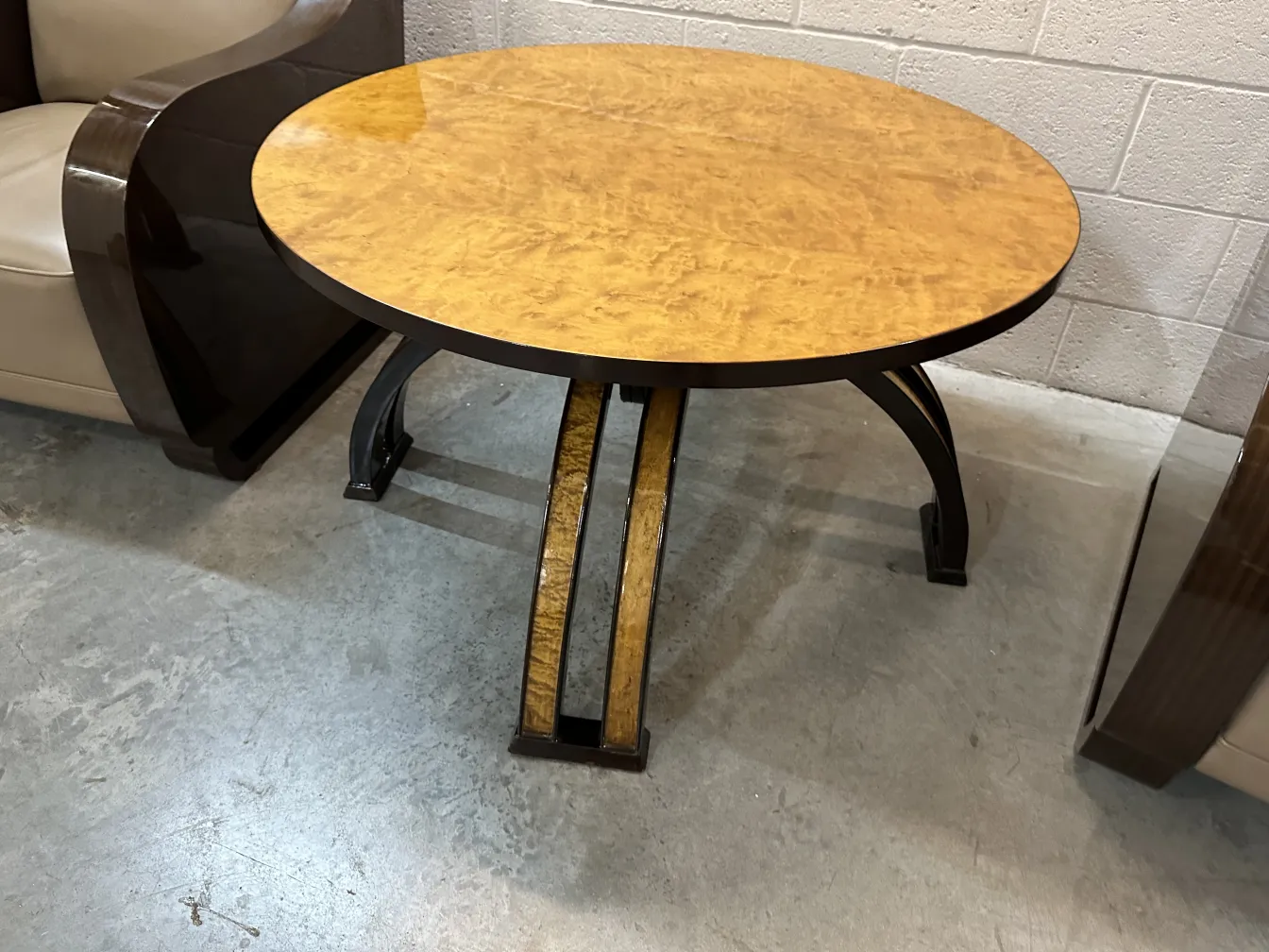 antique round coffee table with a glossy finish in a cozy setting