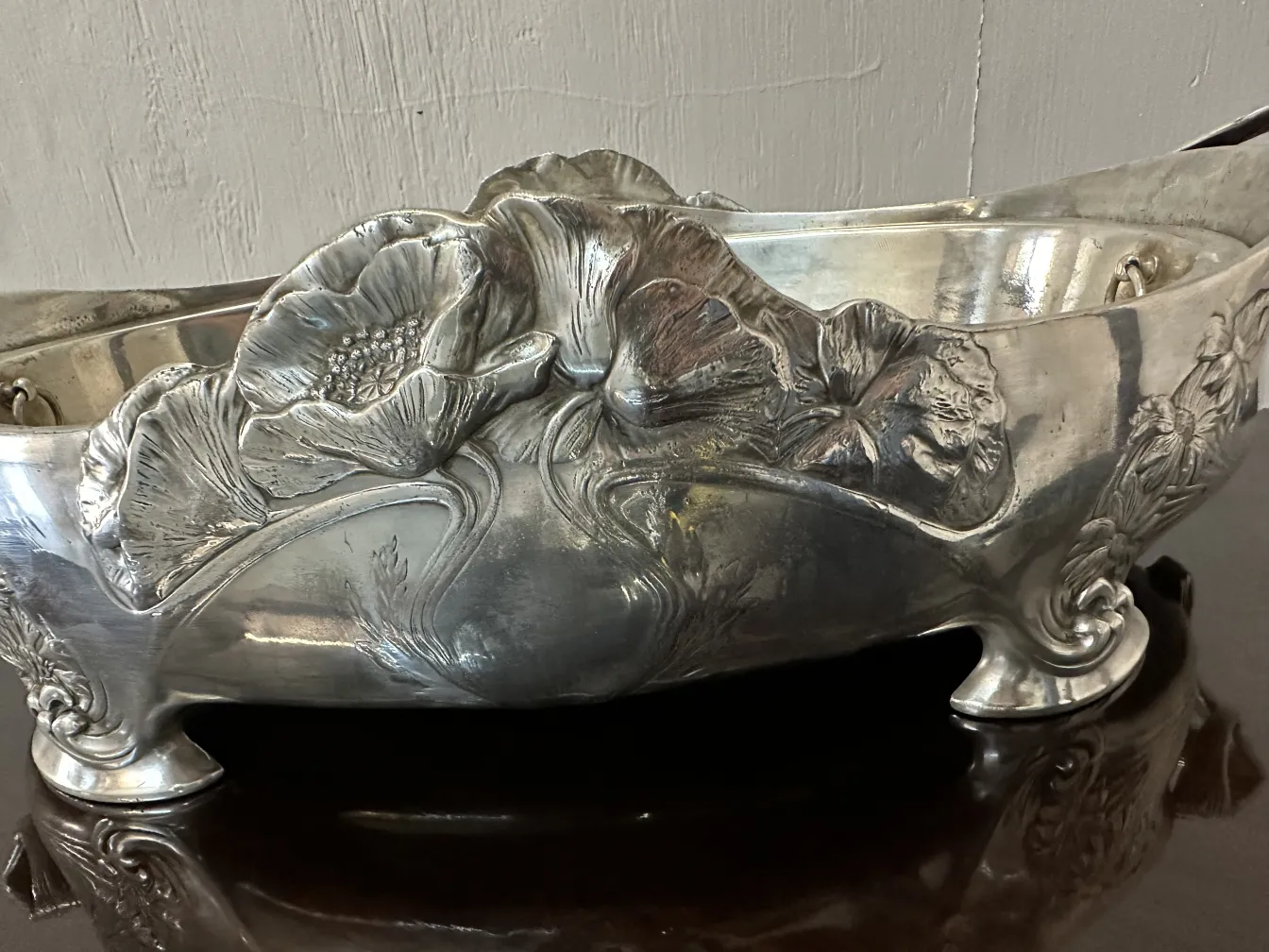 antique centerpiece with floral details on the top, decorative