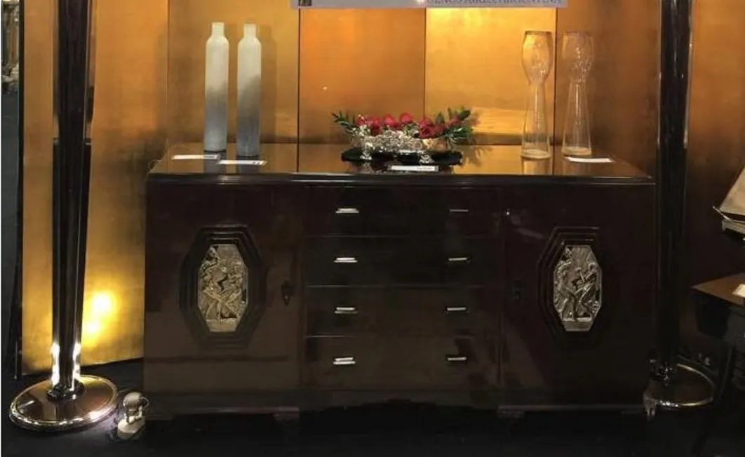 antique centerpiece with roses and decorative elements.