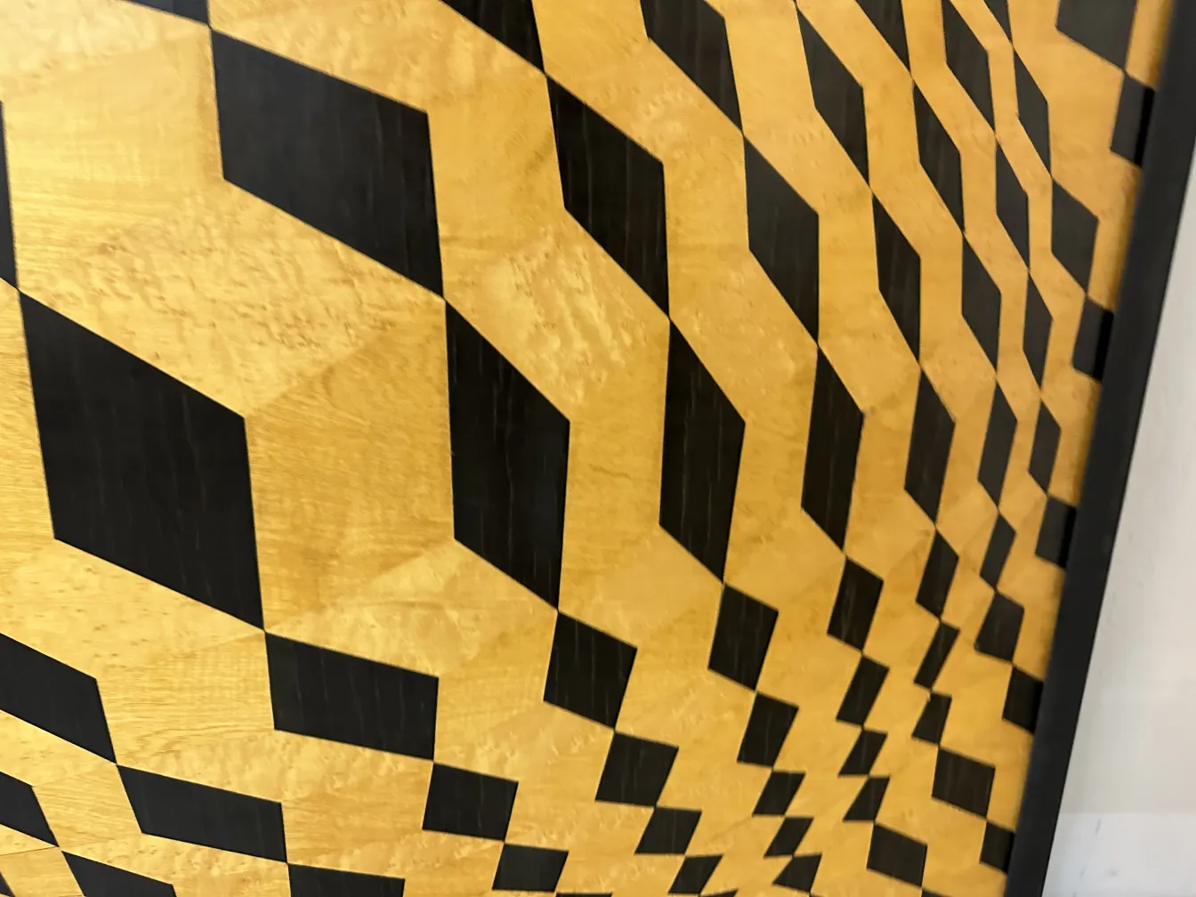 Antique marquetry decor featuring contrasting geometric patterns