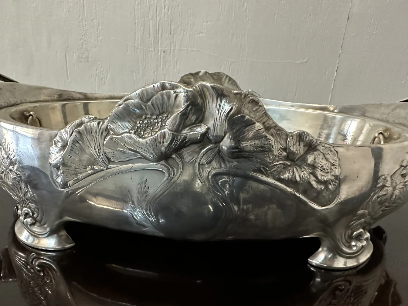 antique centerpiece with carved flowers and elegant feet