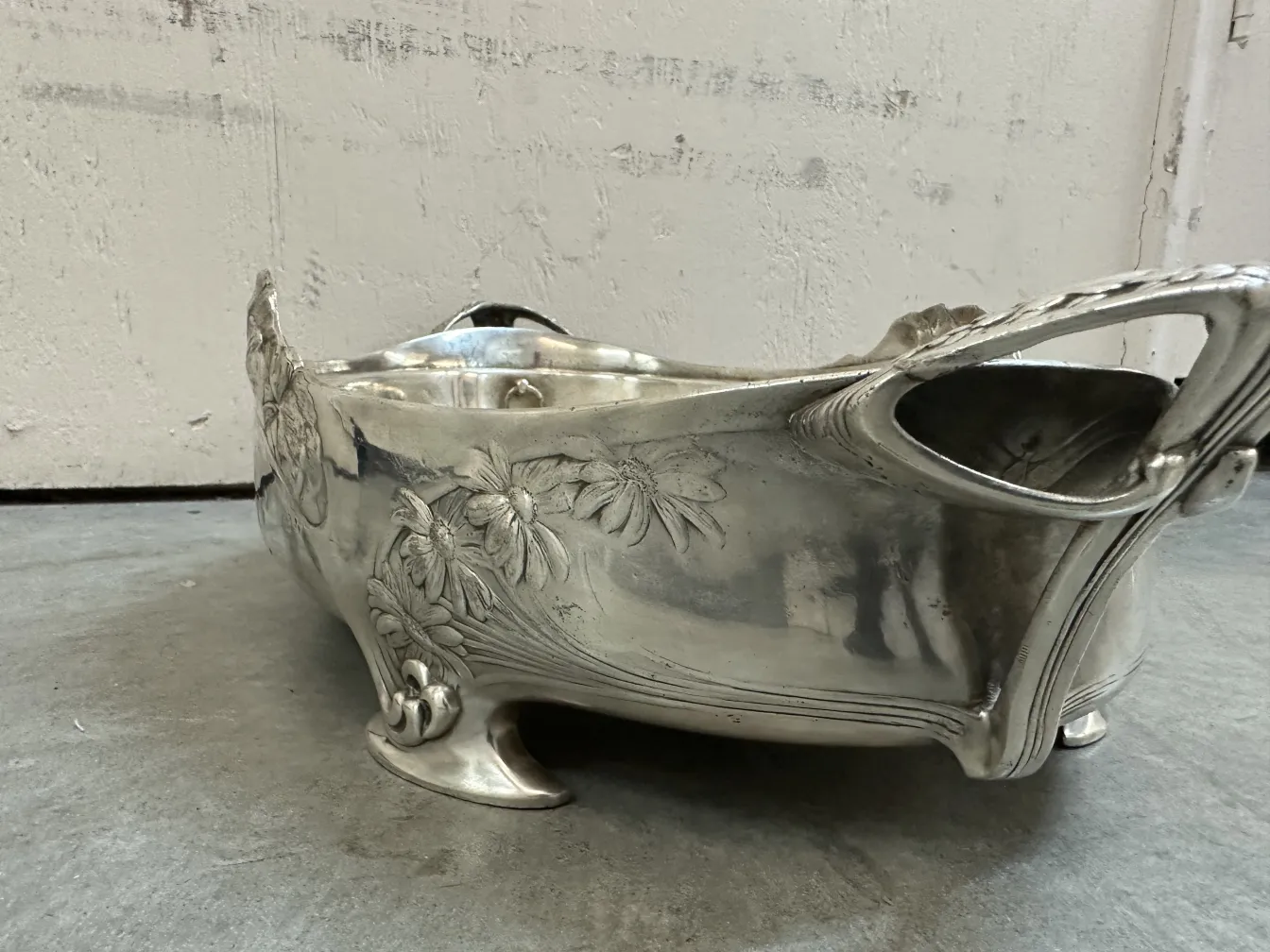 antique centerpiece featuring visible floral decoration