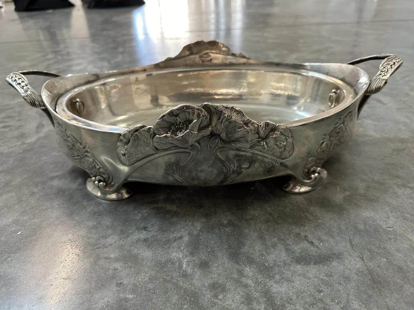antique centerpiece with floral design and handles, decorative