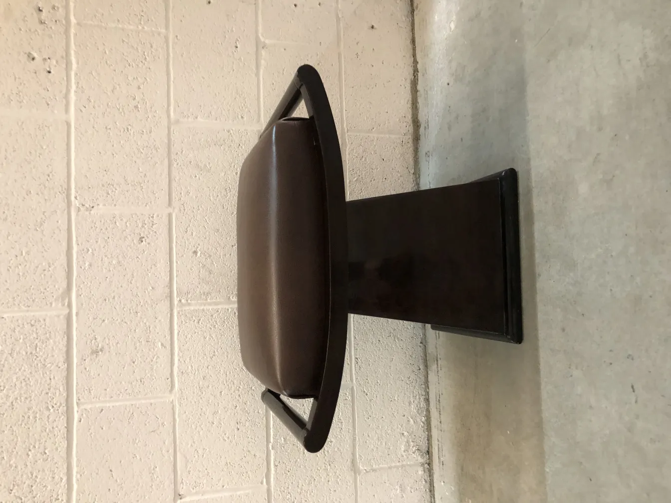 Vintage sidewalk stool with support and padding