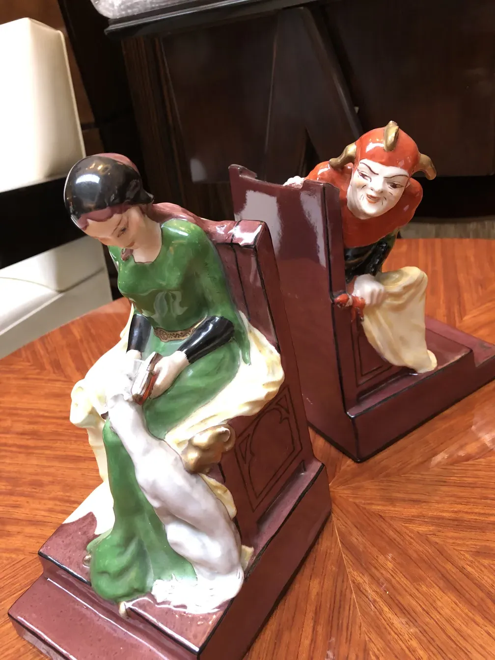 Antique Art Nouveau bookends with decorative figures.