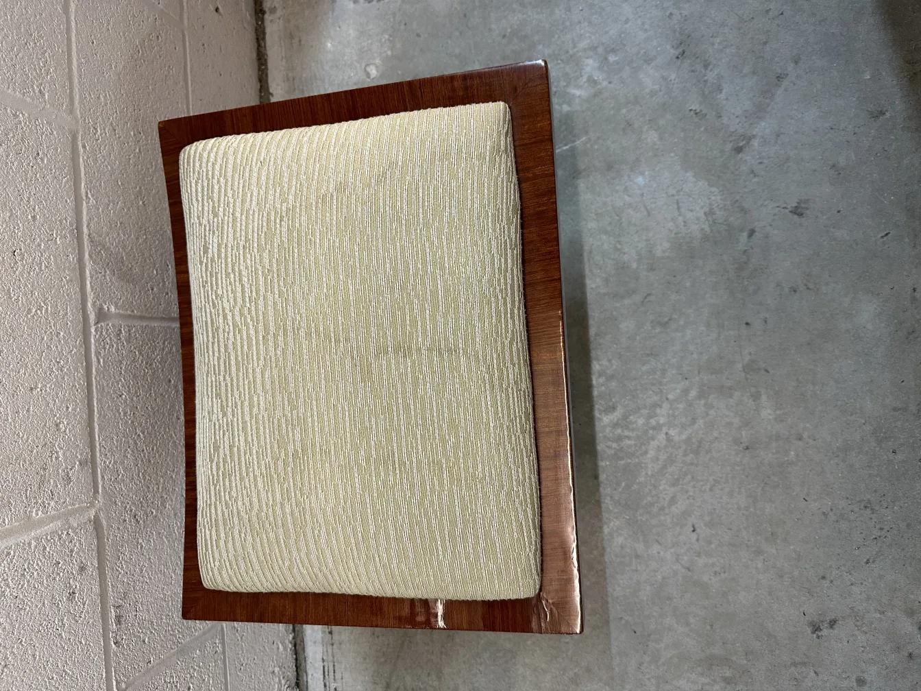 top view of an antique sidewalk stool with a soft light design