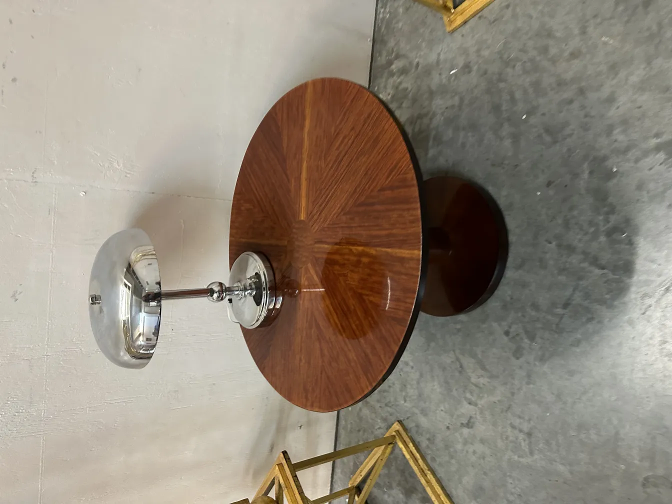 antique round table with silver lamp on top