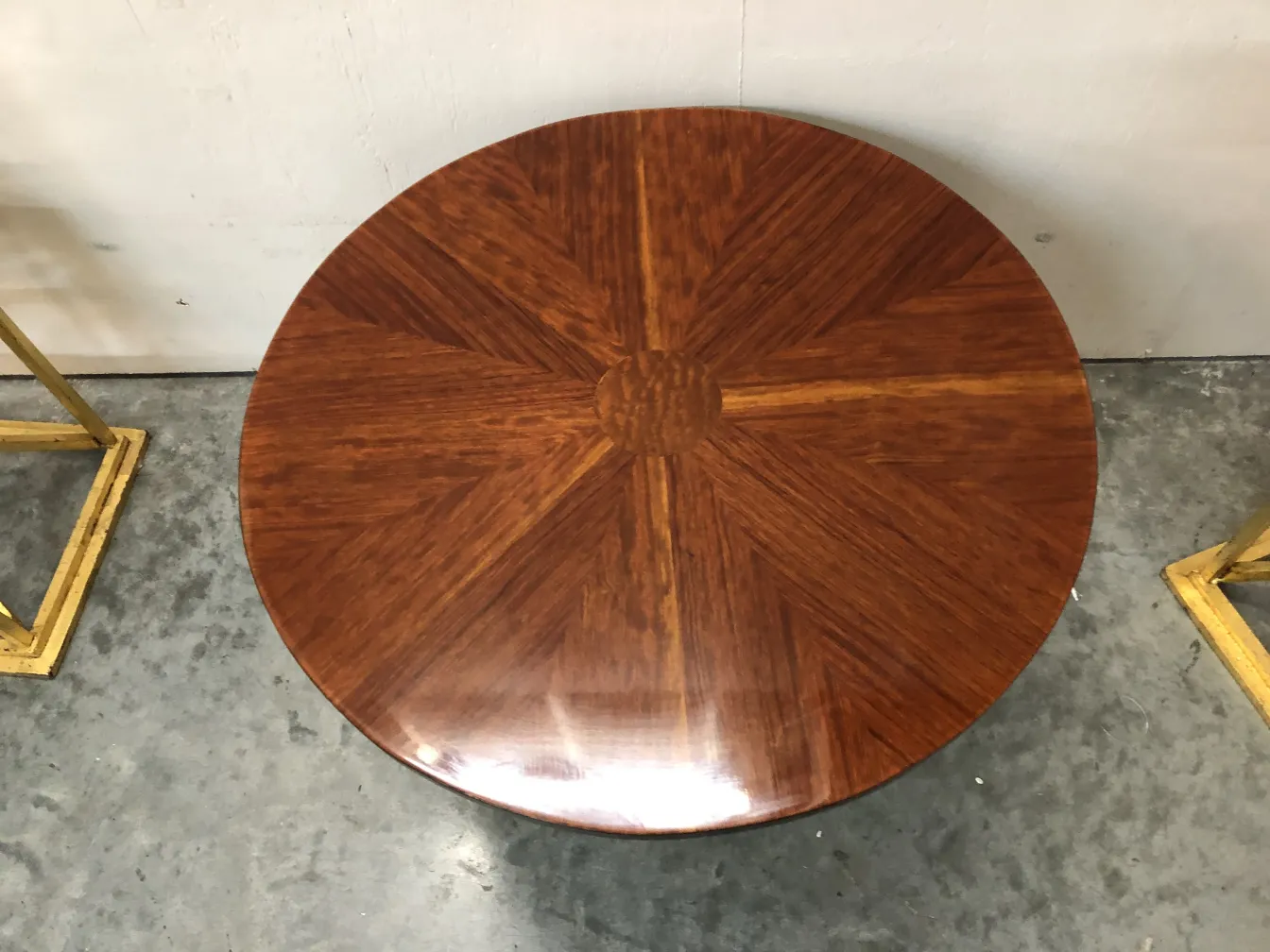 antique round small table with a unique and shiny design