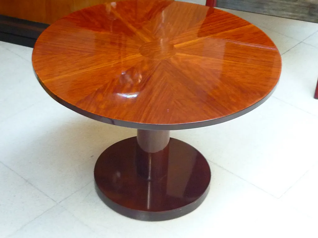 antique small round table with solid base in elegant setting