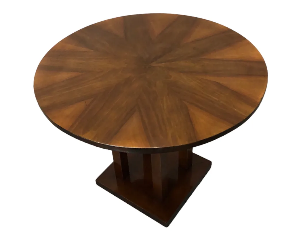 antique round table with brown star-shaped design on top