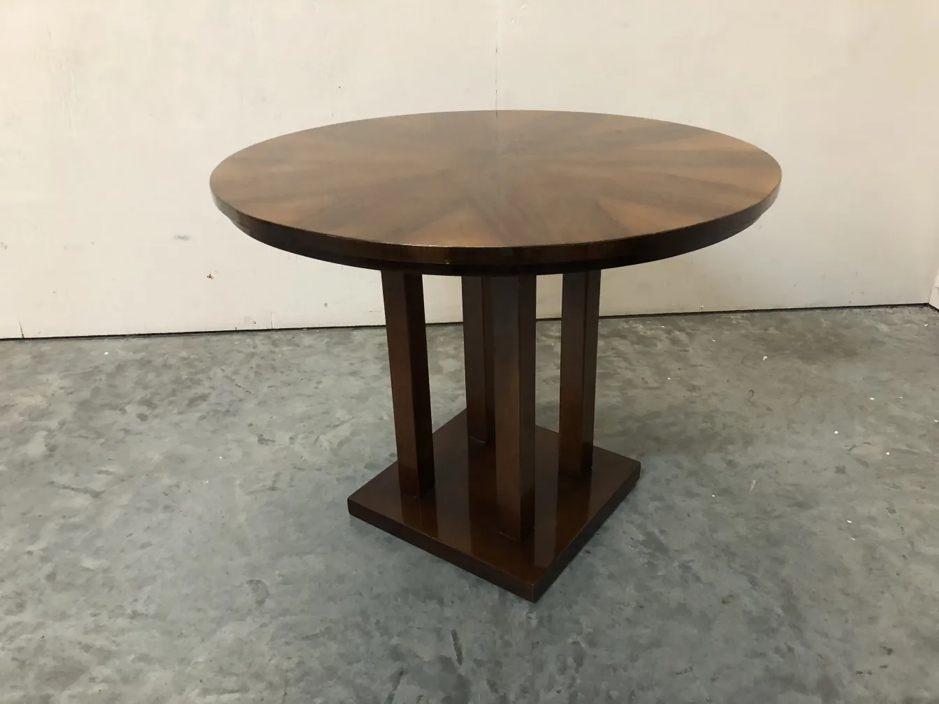 antique round small table with a square base and legs
