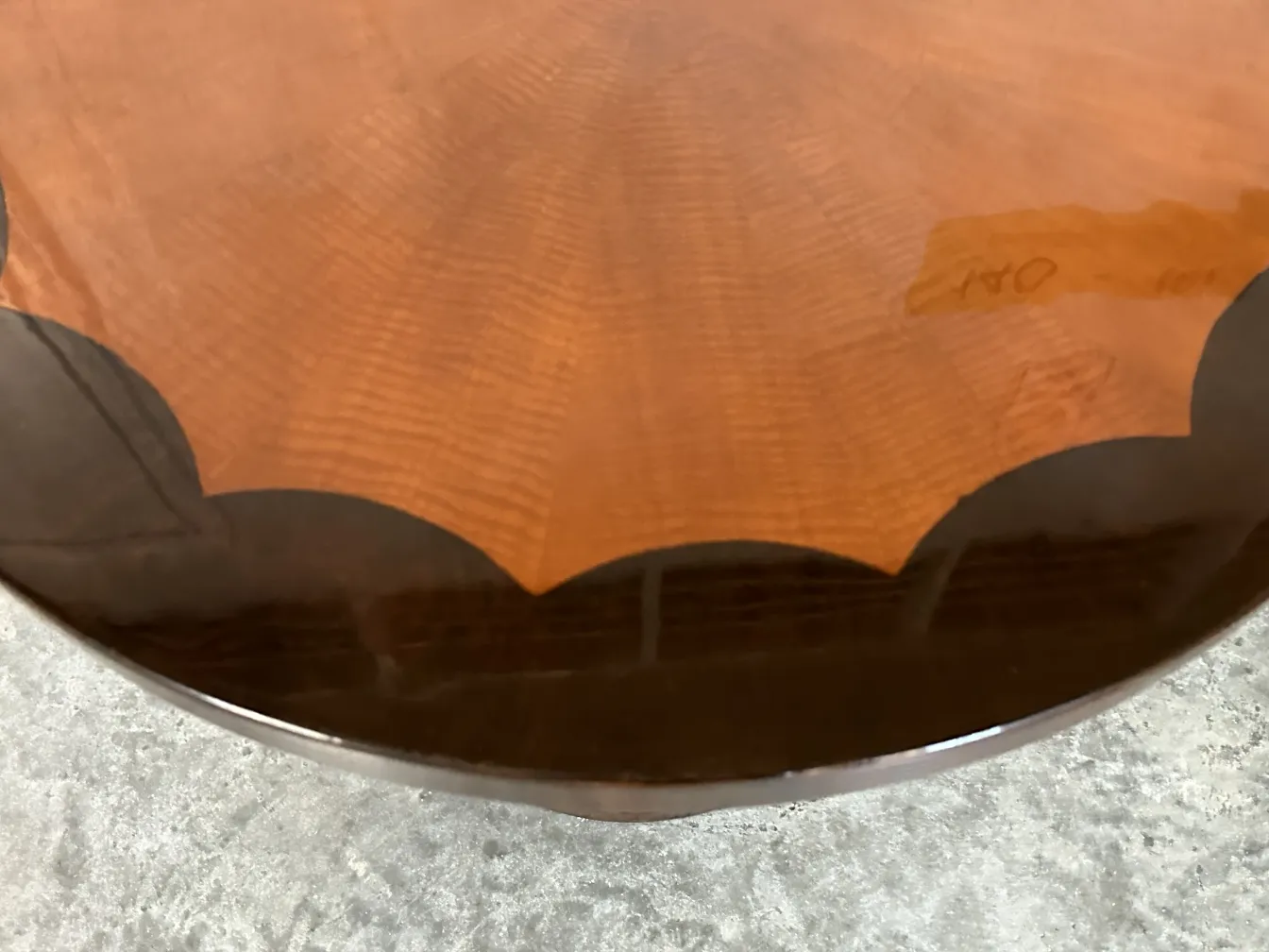 Decorative antique small table with a glossy finish in warm tones.