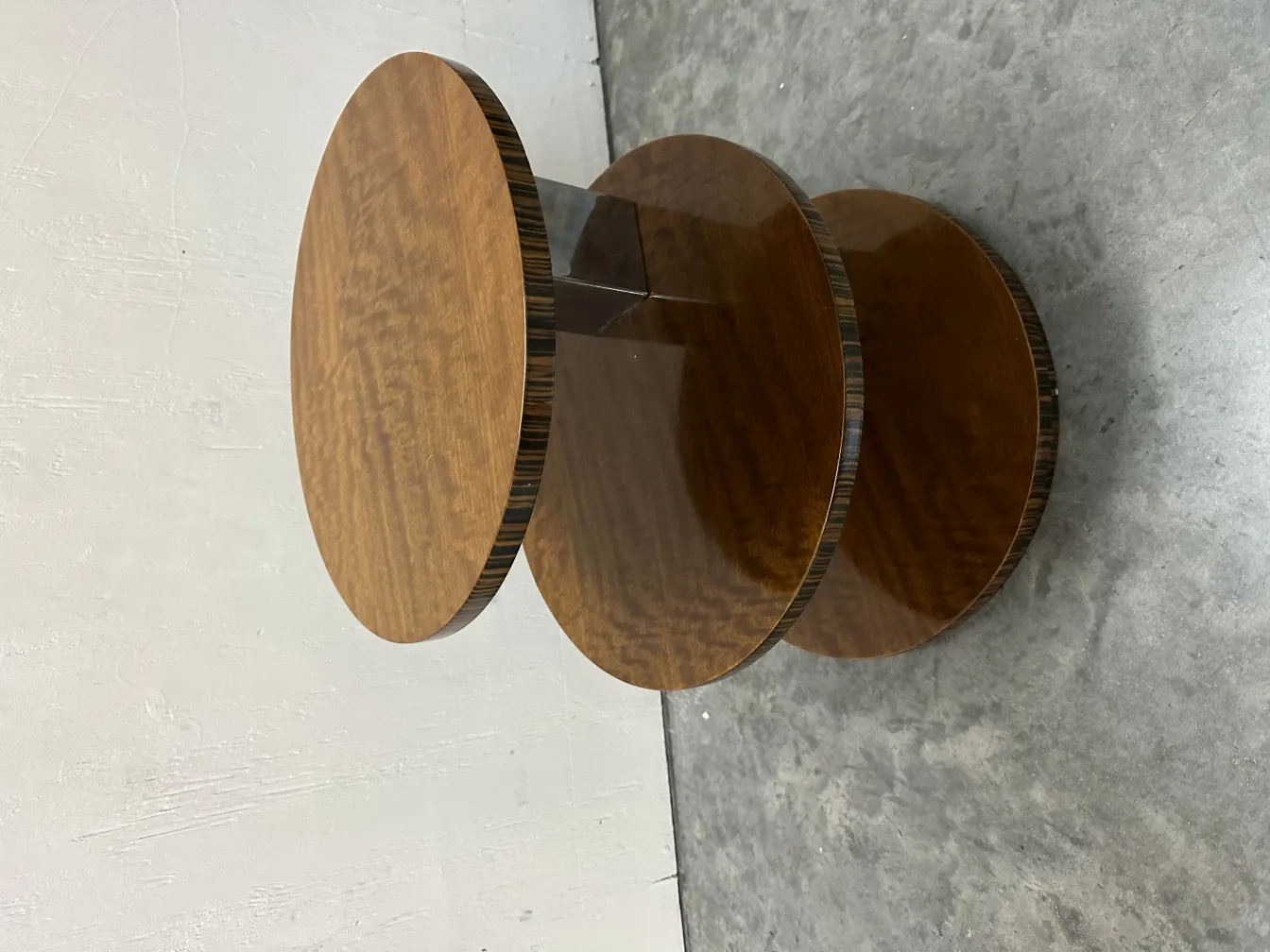 antique small table with two levels in a neutral setting