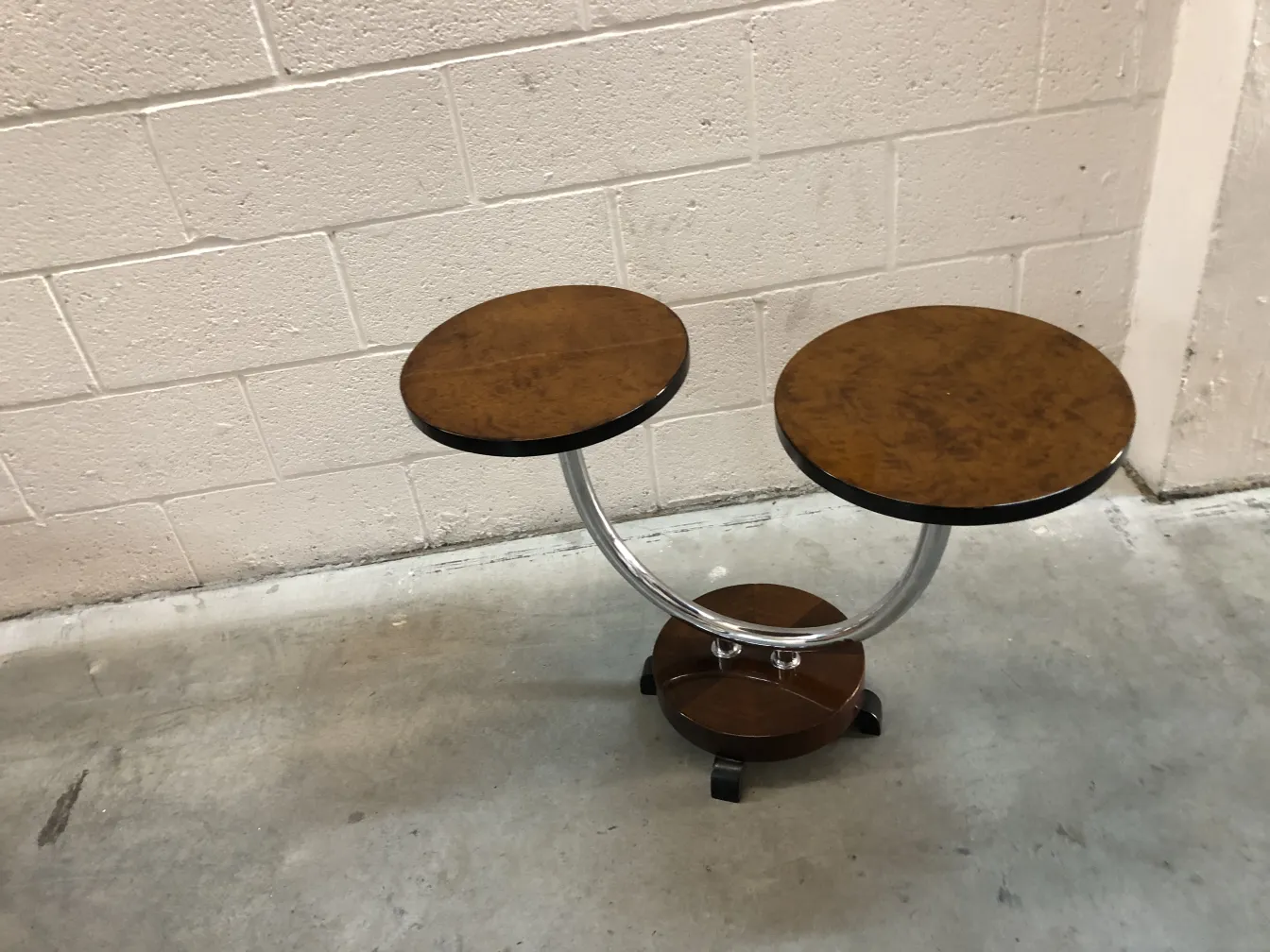 antique small table with two circular tops and a round base