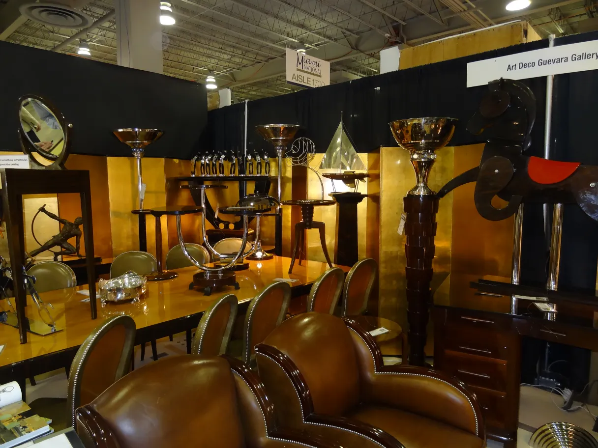 Classic antique small table with a simple and elegant design, surrounded by leather chairs.