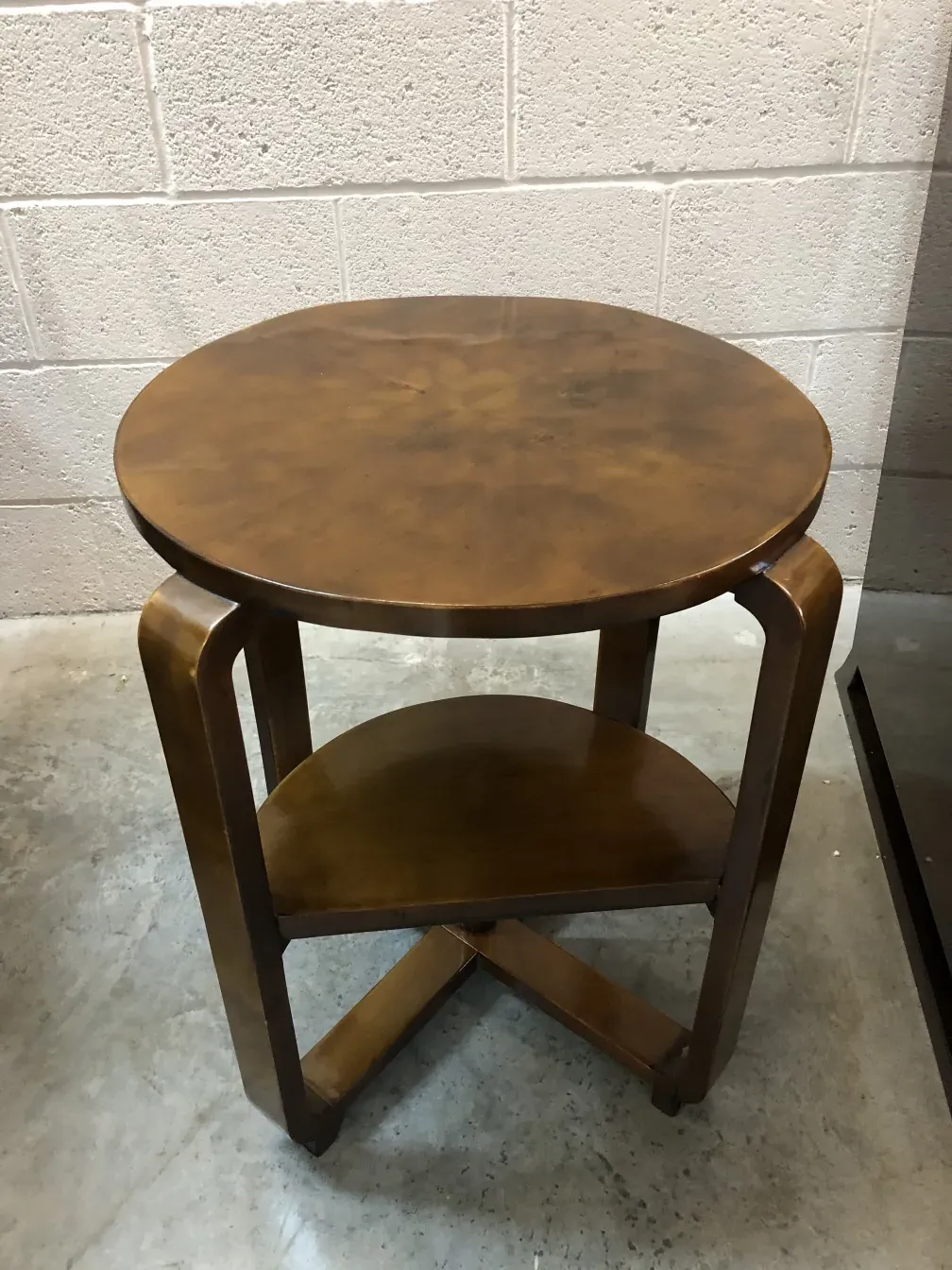 antique round small table with classic shape in simple surroundings