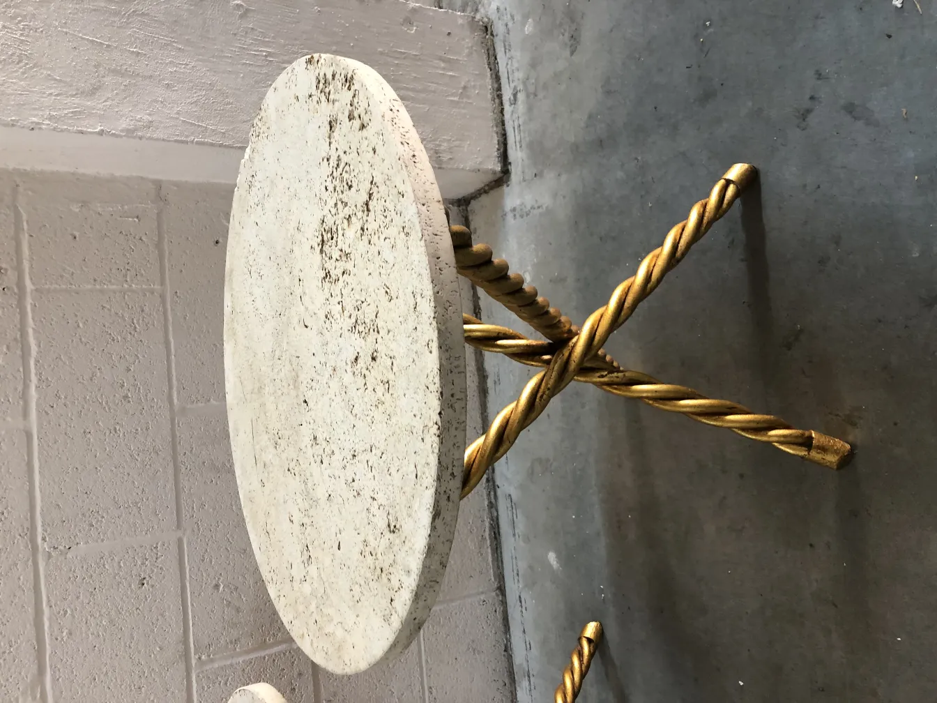 two antique small tables with a golden base and light top