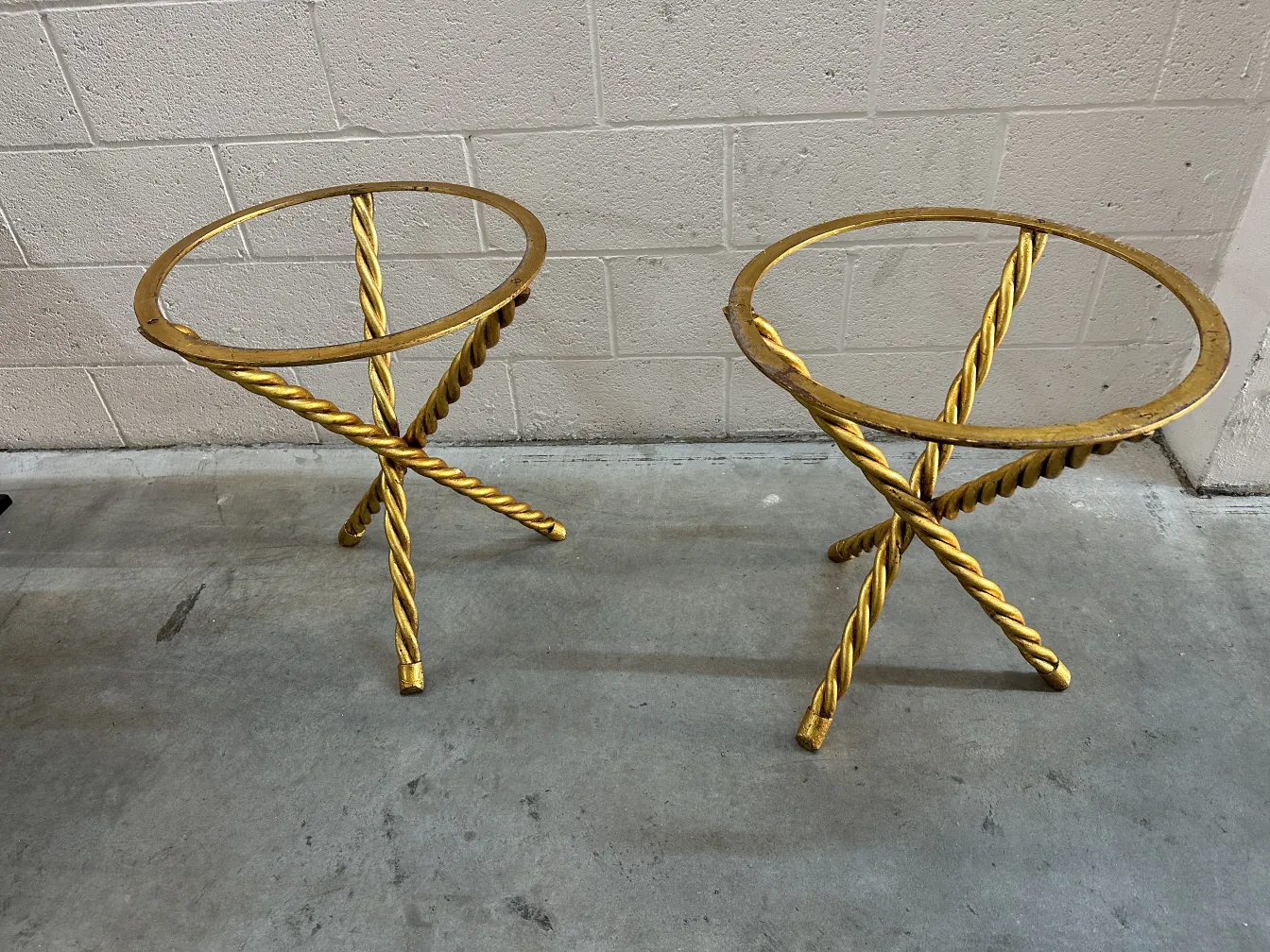 2 small antique tables with decorative design and intertwined legs