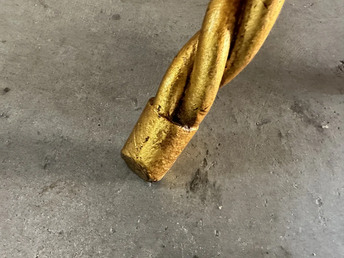 two antique small tables with decorative design in a neutral setting