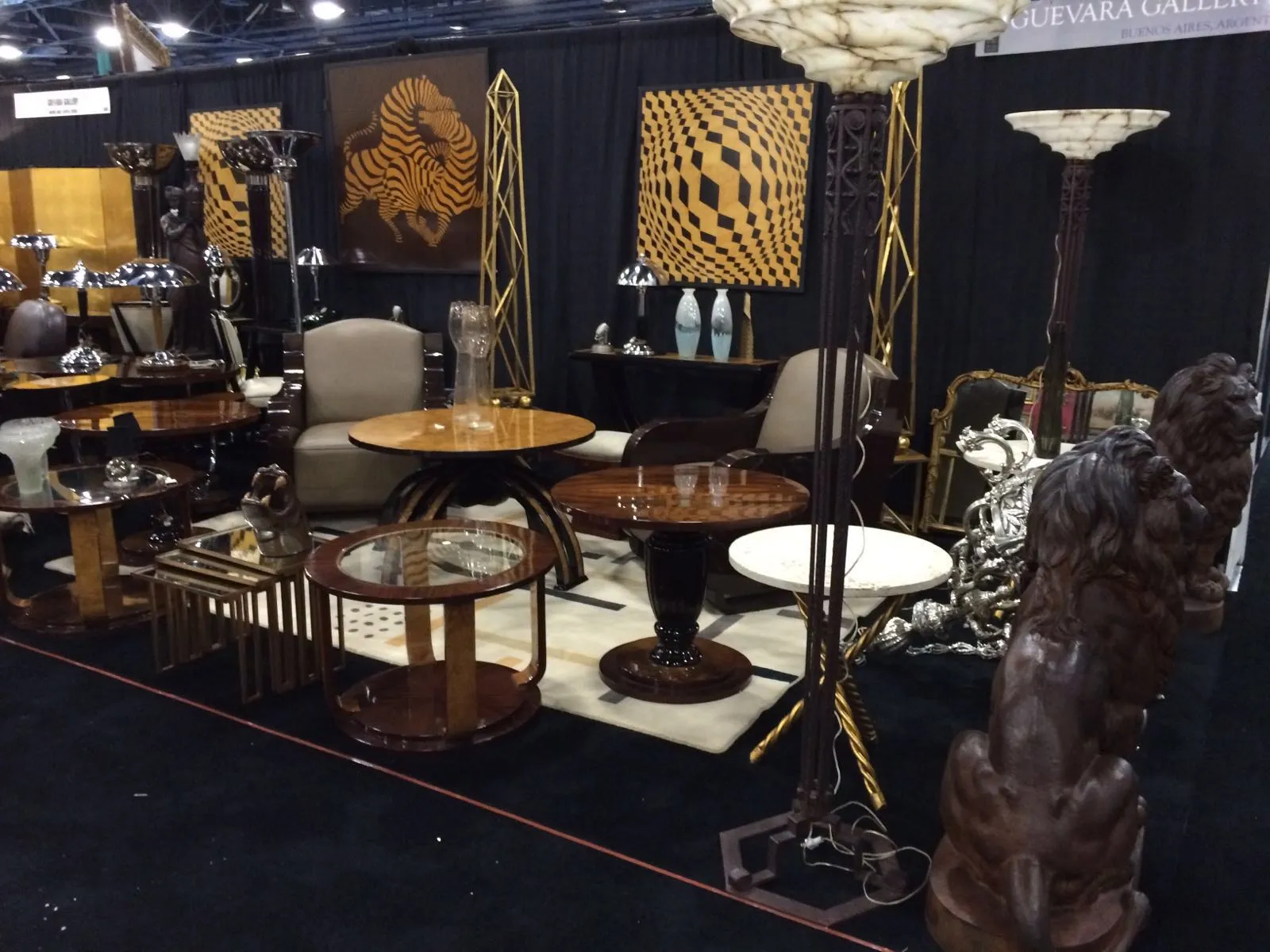 2 small antique tables in a decorative setting with other objects