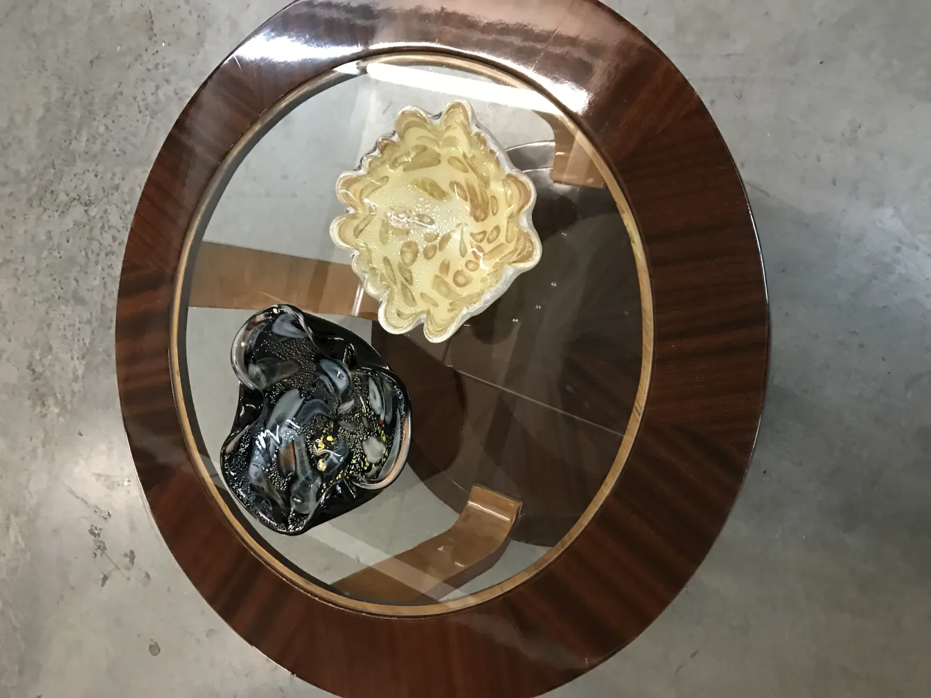 two antique small tables with decorations on top