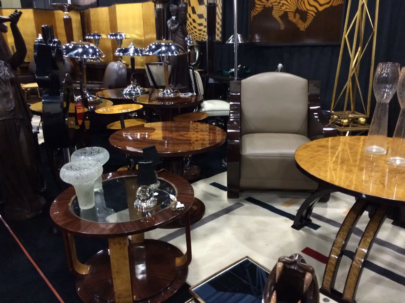 Two antique small tables with an elegant design in a decorative setting.