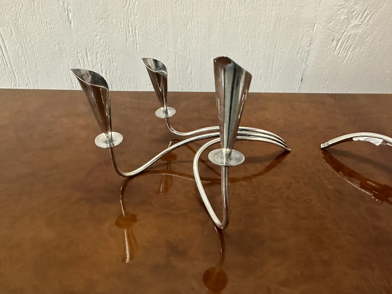 2 antique candle holders with three curved arms