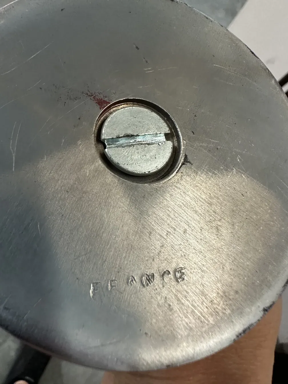 Detailed photo of the base of an antique candlestick maison desny