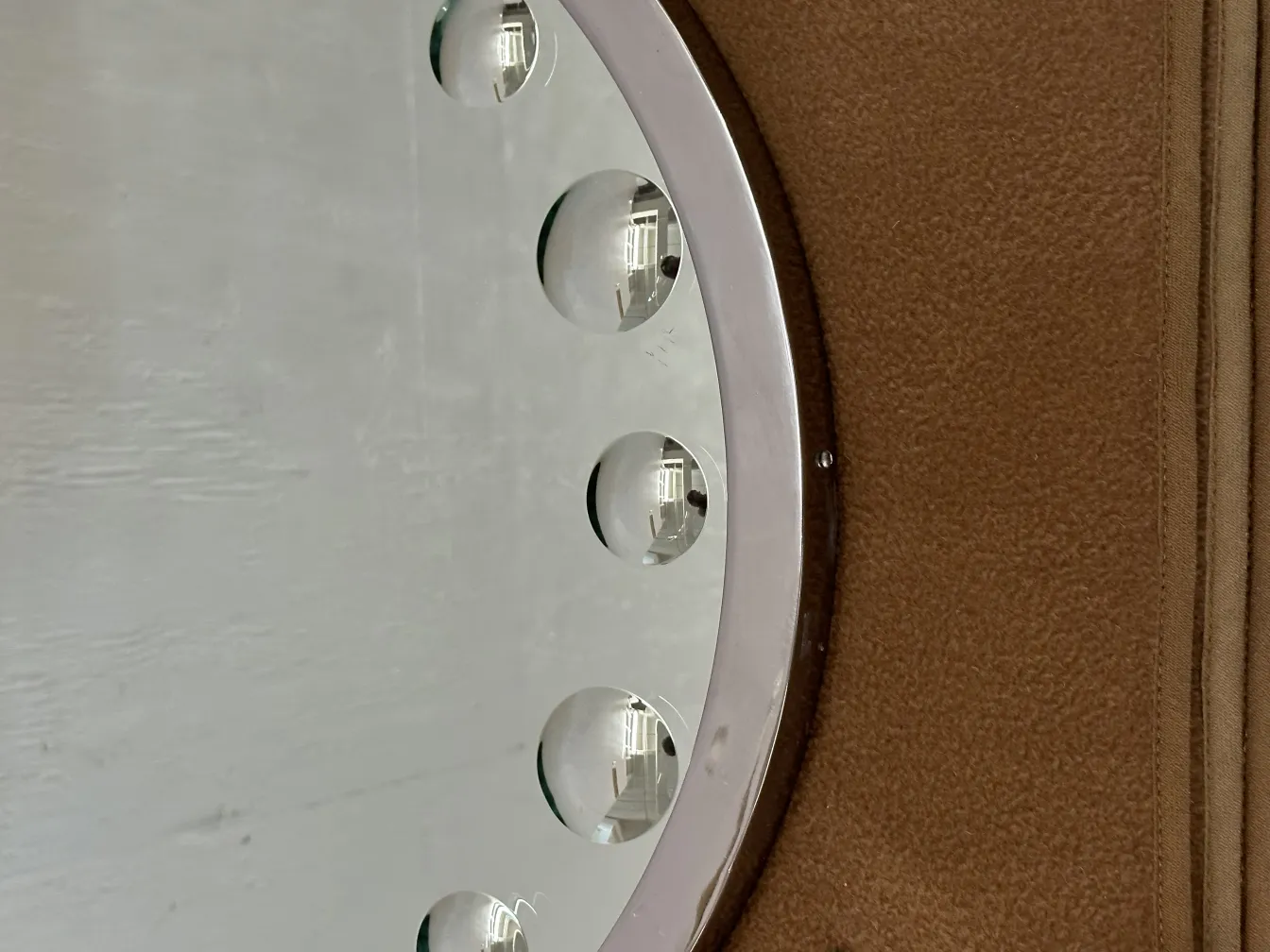 antique mirror with decorative bubbles and light background