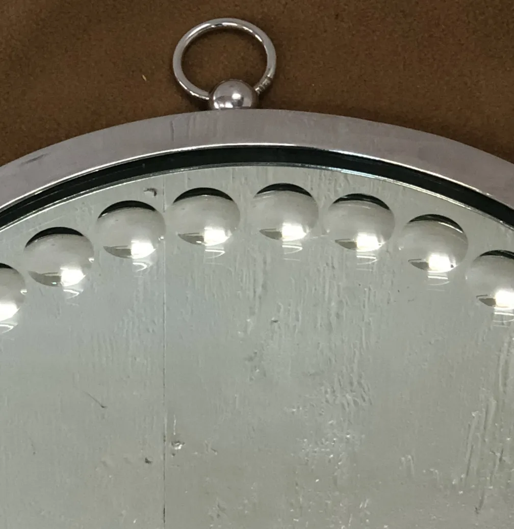 Two antique mirrors in a decorative setting