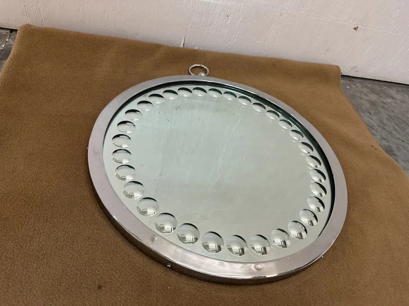 Two round antique mirrors with decorative design