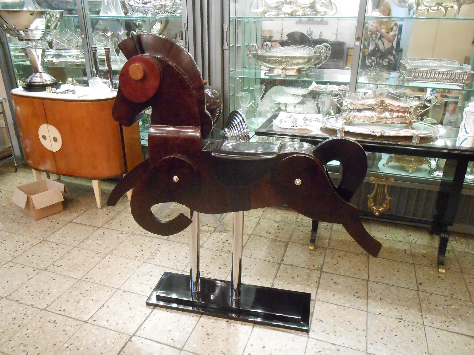 antique sculpture of 2 horses in an elegant setting