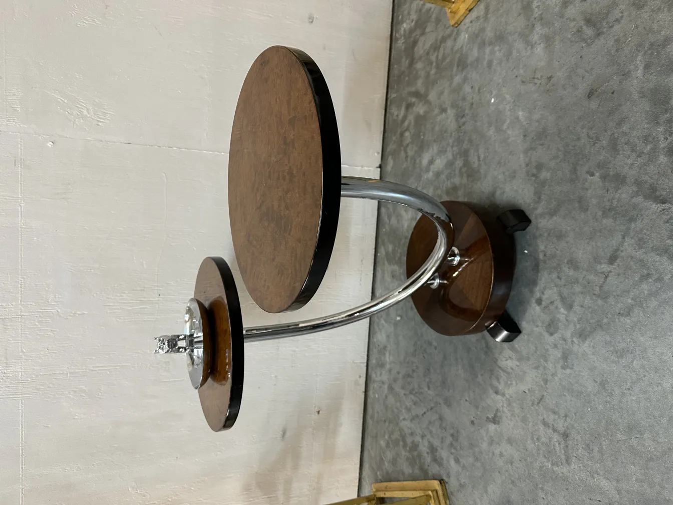 Antique ashtray with a decorative table and support.