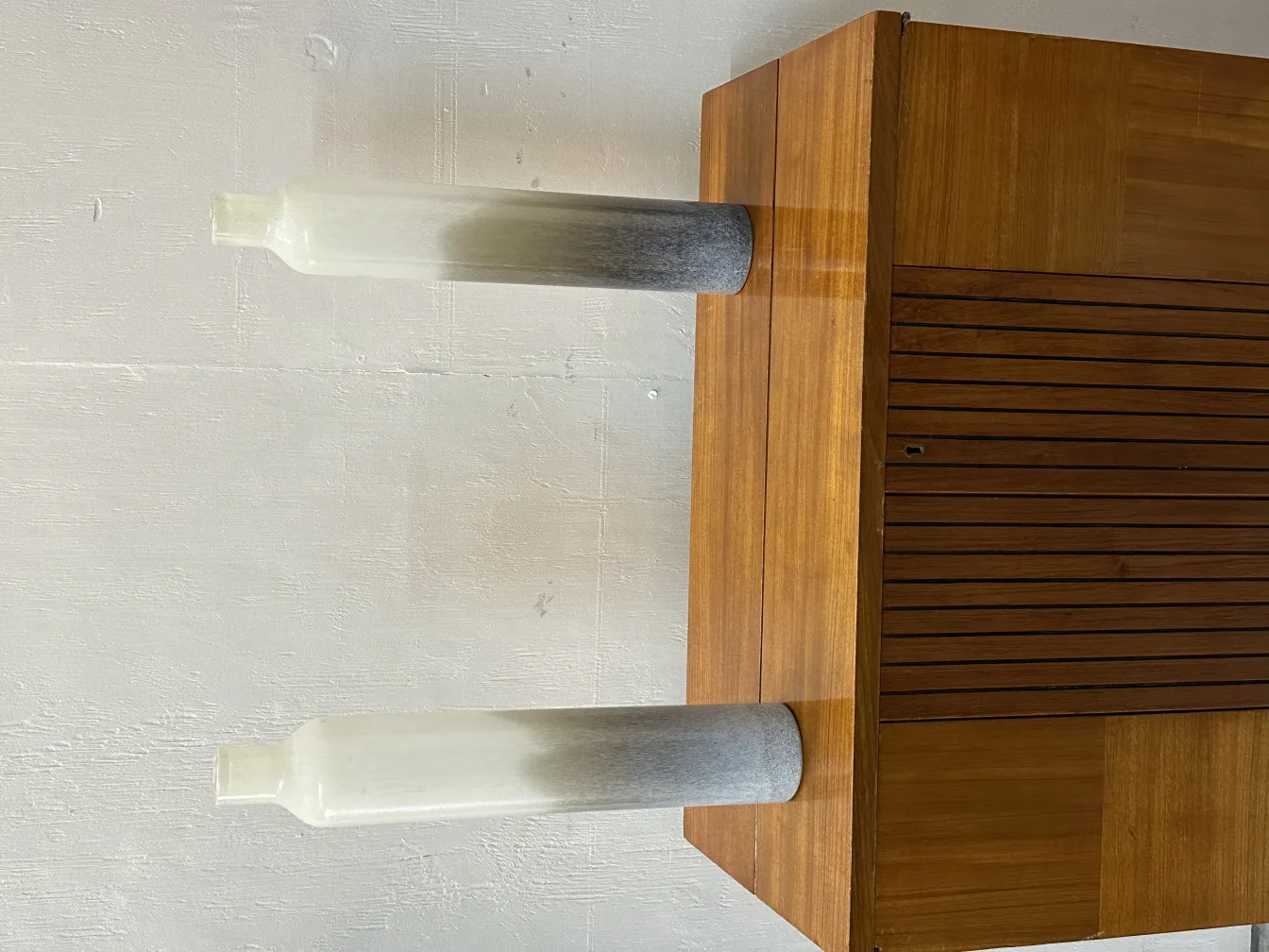 Antique bar with two decorative bottles and light background