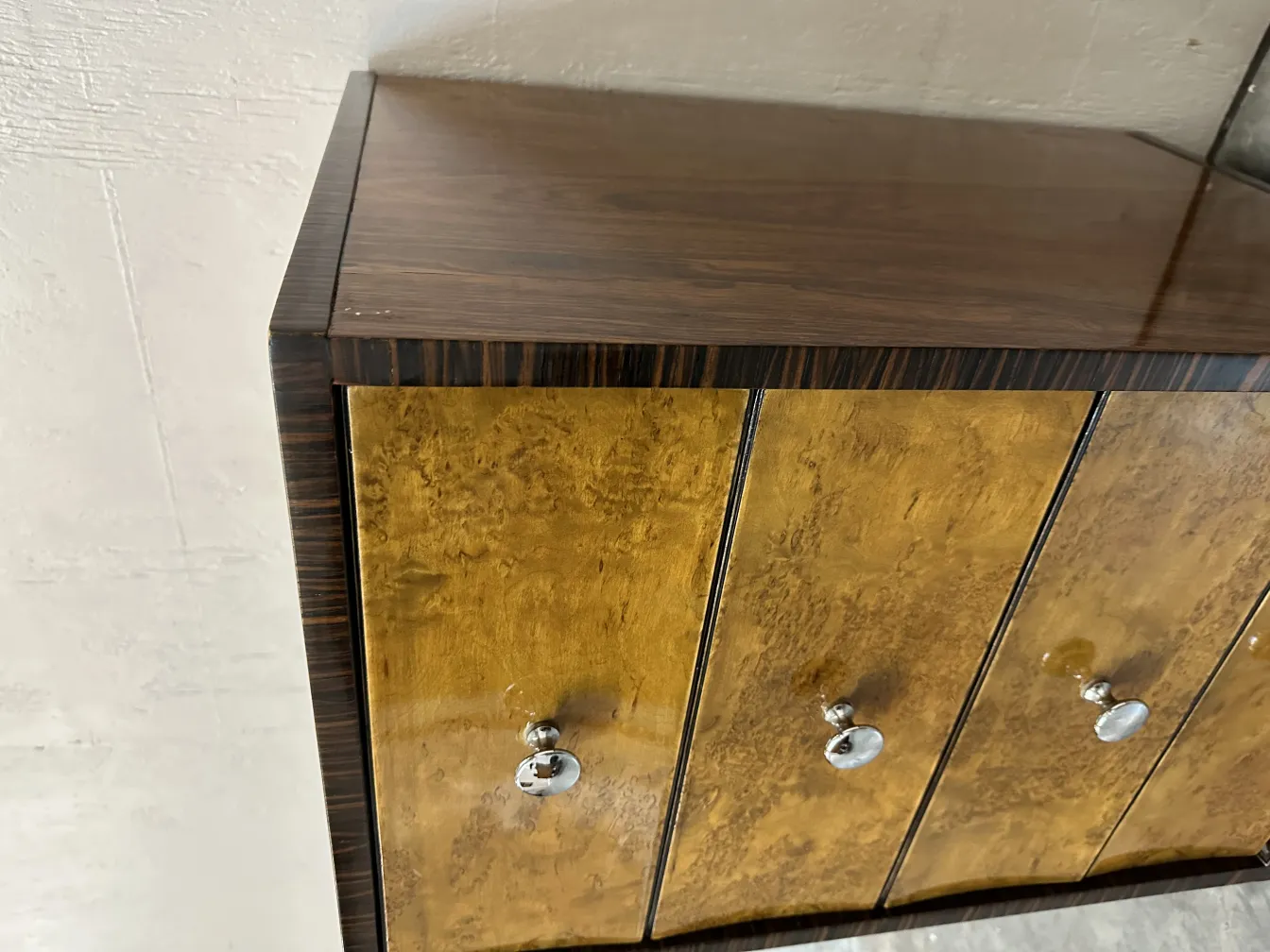 antique cabinet with shiny finish and six drawers