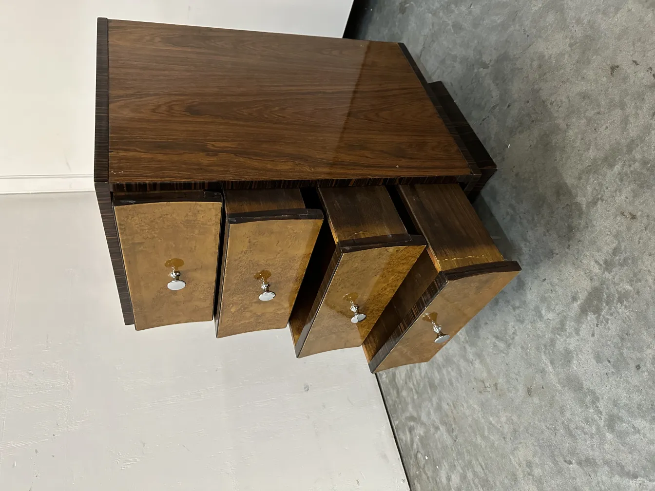 Antique cabinet with metal handles in a neutral background