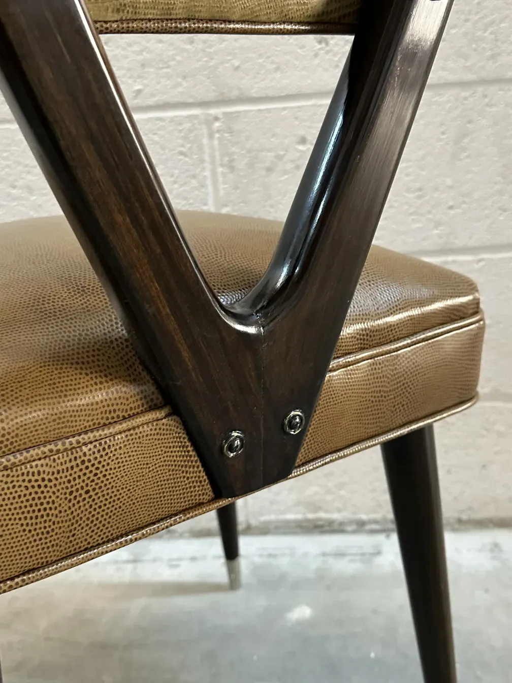 Close-up of carlo mollino antique chairs in leather