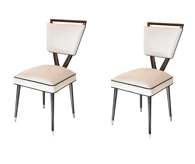 Set of 2 antique chairs with an elegant design in a cozy environment