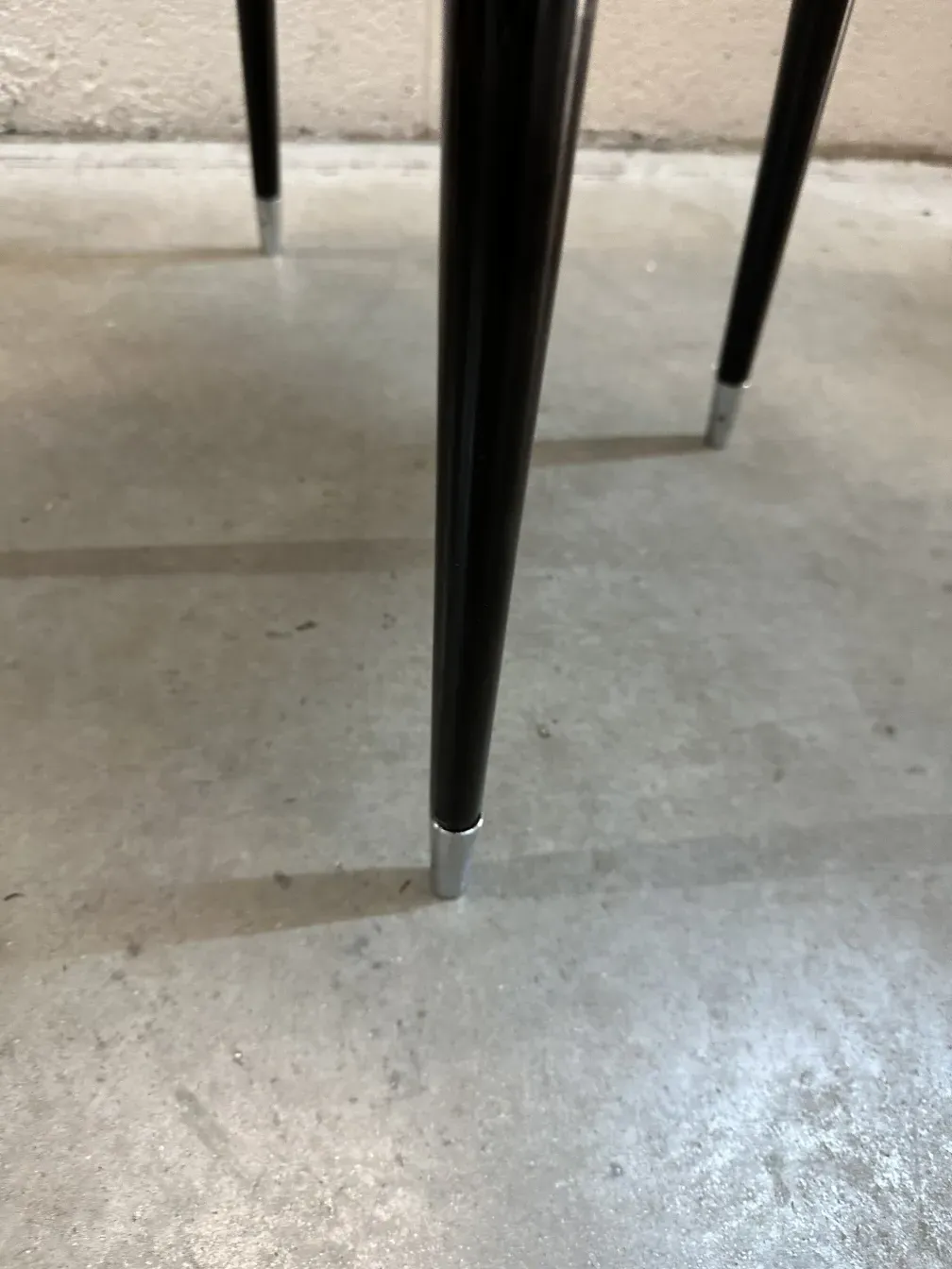 Details of 2 antique chairs in a neutral setting